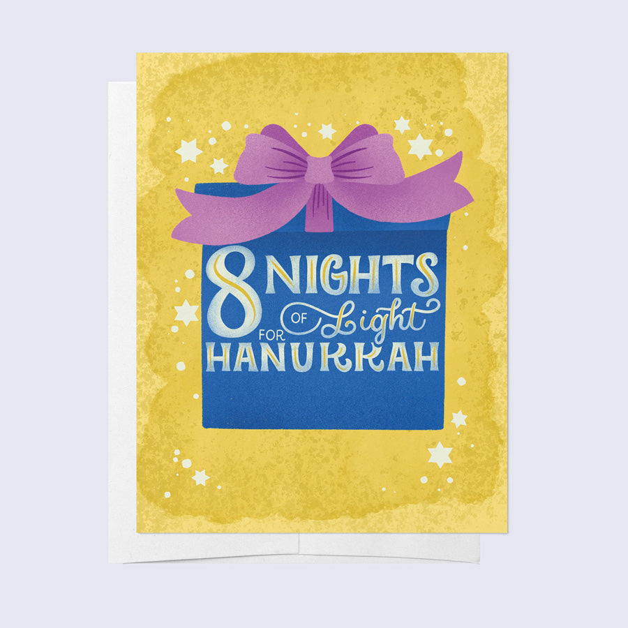 greeting card of a wrapped gift that says "8 nights of light for hanukkah" on a yellow background