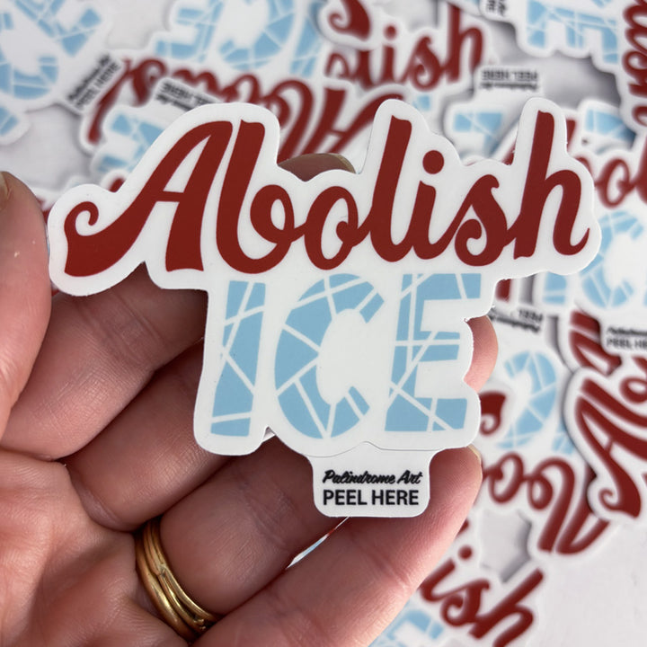 Sticker with 'Aoolish Ice' text held in a hand, with more stickers in the background.