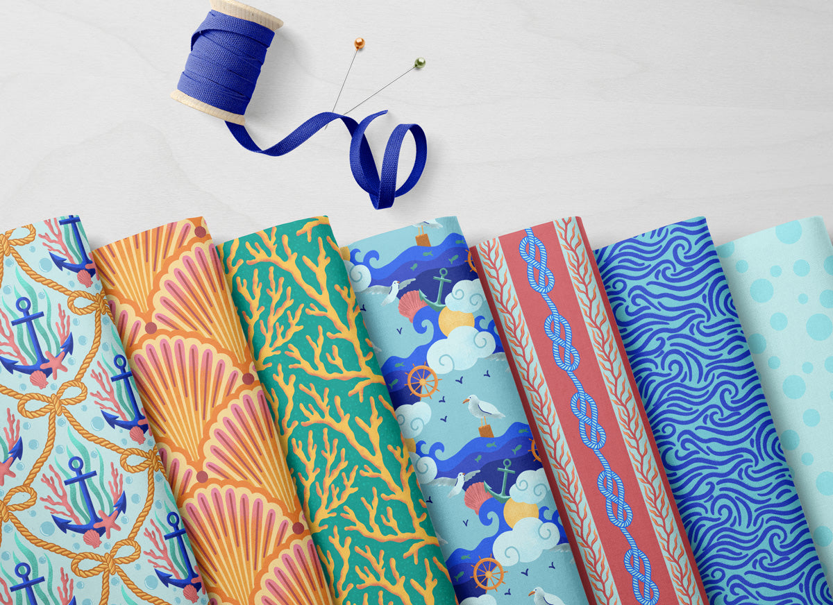 Collection of colorful fabric swatches with nautical patterns on a white background
