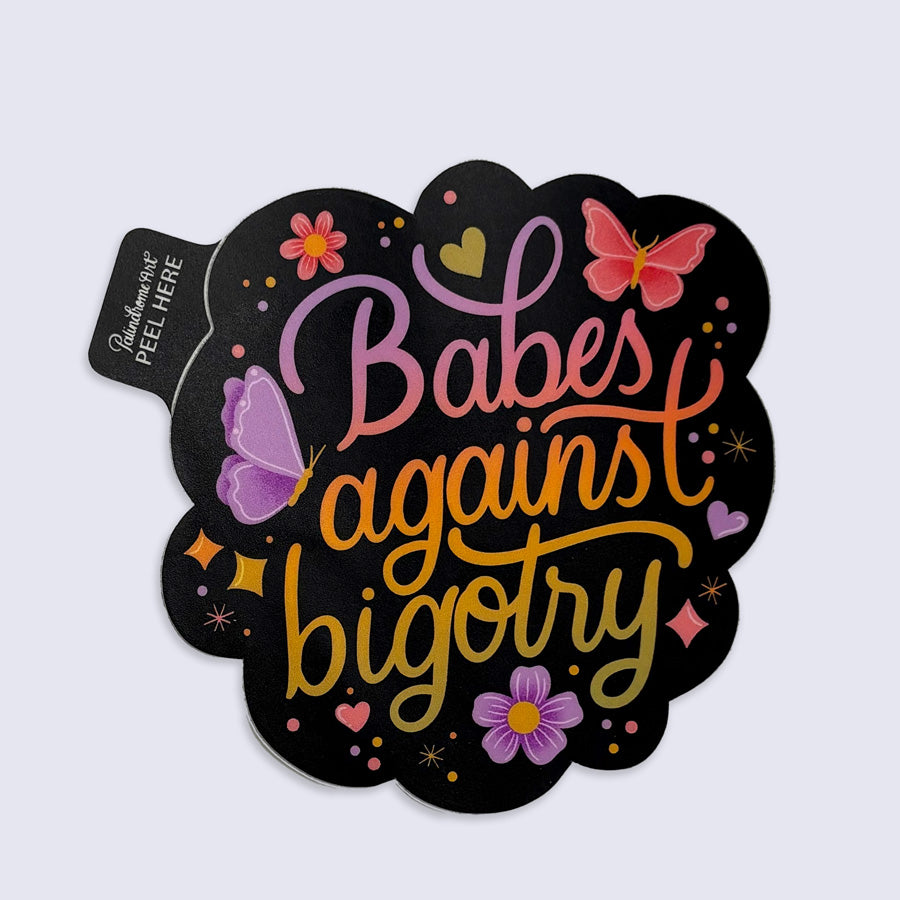 Sticker with 'Babes against bigotry' text and decorative elements on a light gray background
