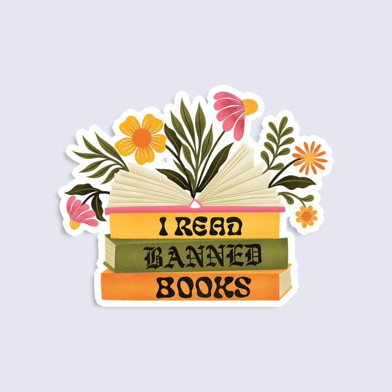 sticker of a stack of books that says "I read banned books" with flowers