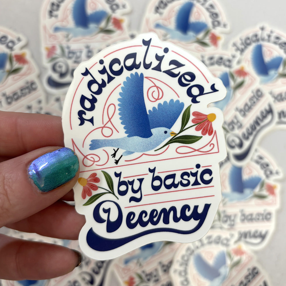 Sticker with a blue bird design and text held by a hand with teal nail polish, surrounded by more stickers.