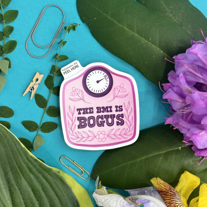 Sticker with 'The BMI is Bogus' text on a blue background with leaves and flowers