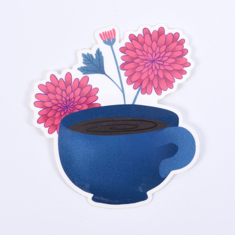 sticker of a blue coffee mug with pink flowers