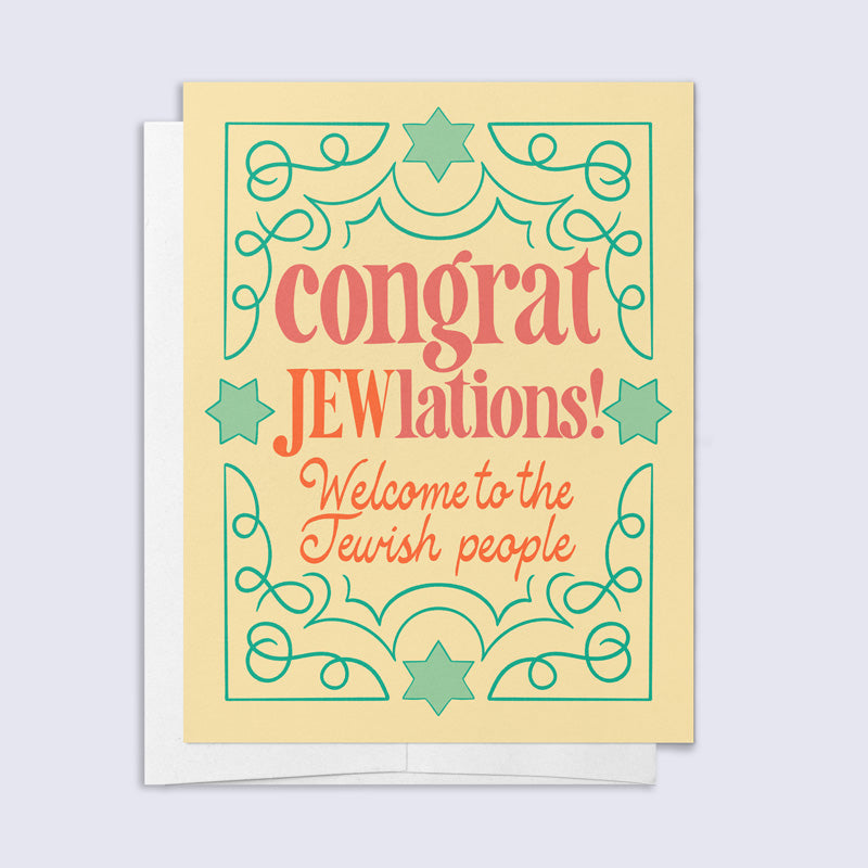 Card with decorative text and stars on a light blue background that reads "congrat JEWlations! Welcome to the Jewish people"