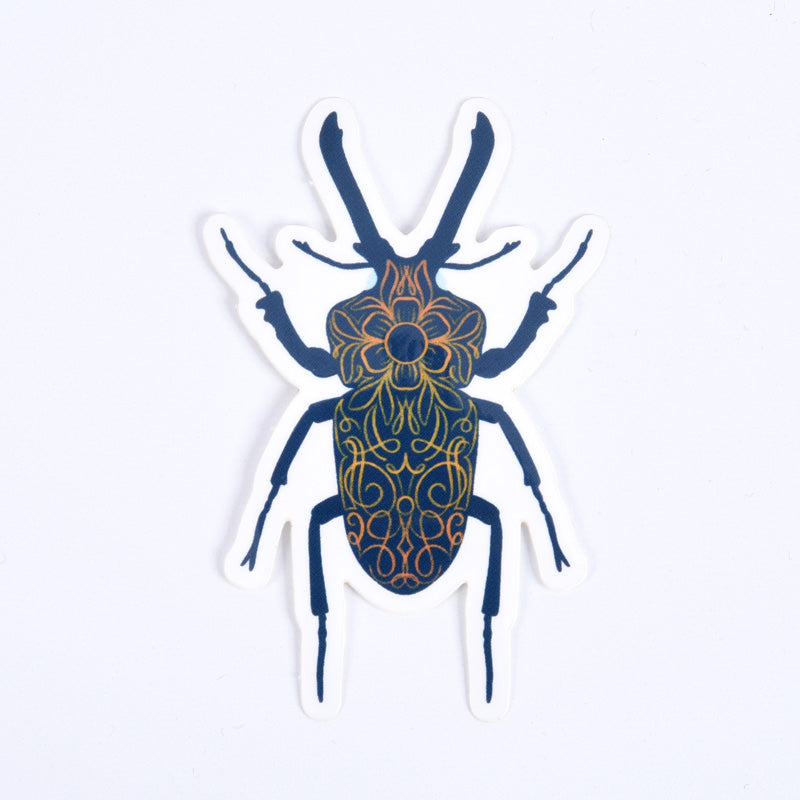 A sticker depicting a blue stag beetle with ornate red orange and blue patterns.