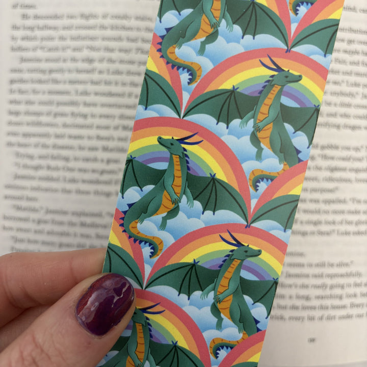 bookmark featuring illustrations of dragons in a rainbow sky!