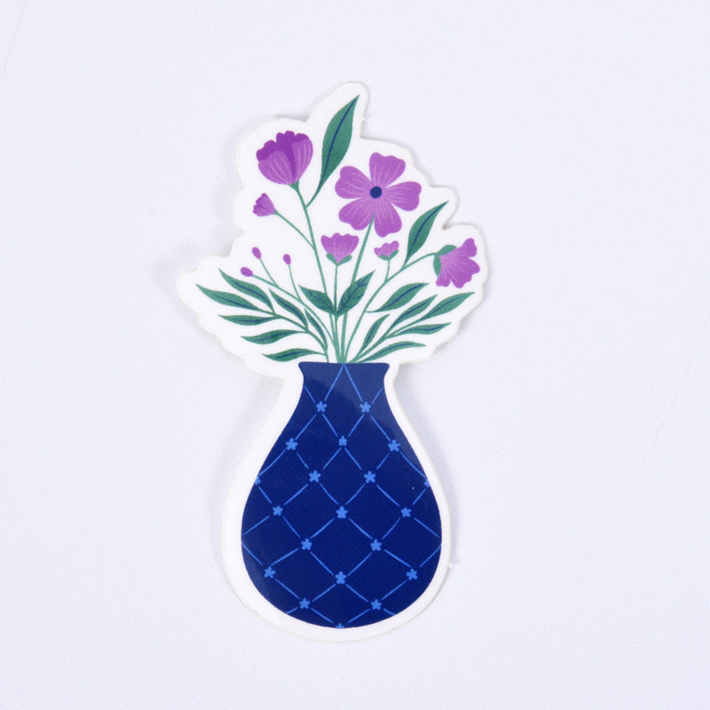 sticker of a blue flower vase with purple flowers