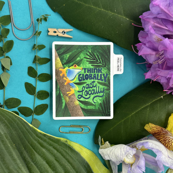 sticktr with a frog illustration and 'Think Globally, Act Locally' text on a blue background with leaves and flowers.