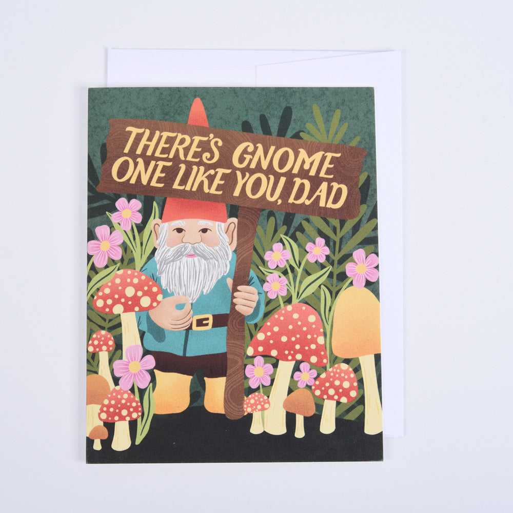 greeting card of a gnome wearing a red hat holding a sign that says "there's gnome one like you, dad" in front of mushrooms and florals