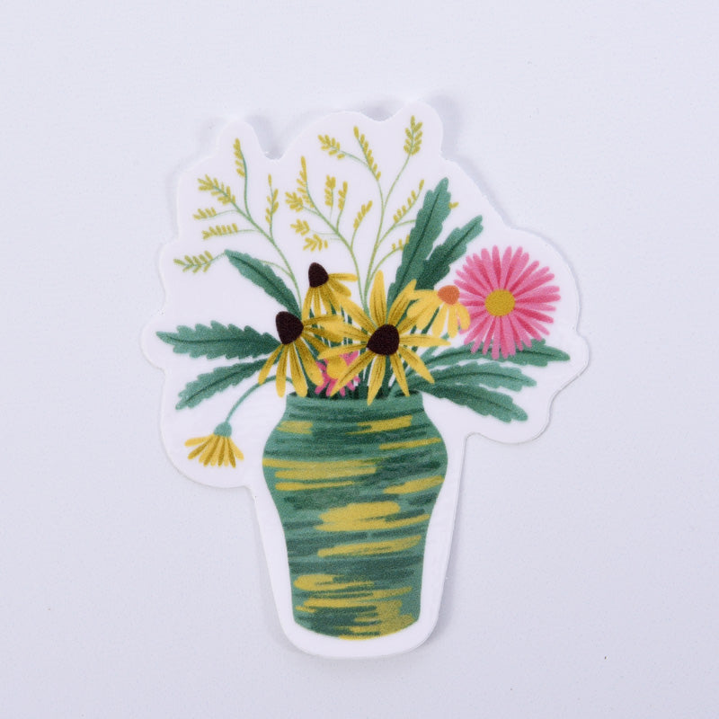 A sticker with a floral design featuring a bouquet of flowers in a green vase, highlighted with watercolor-like colors.