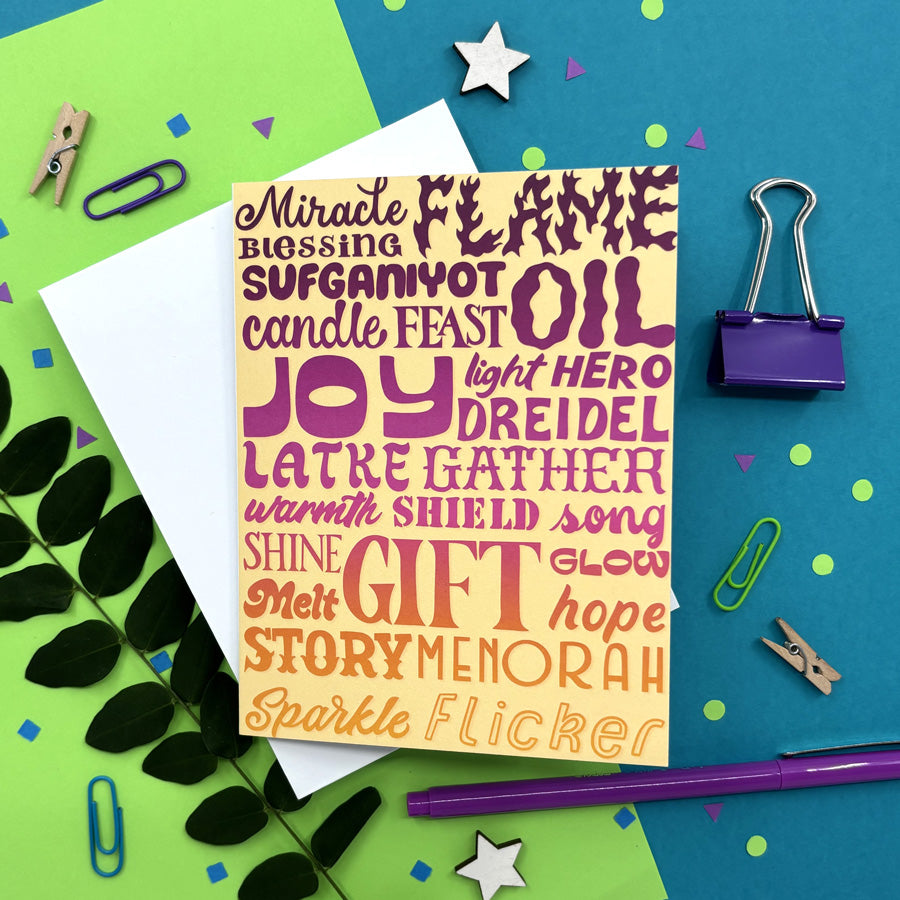 hanukkah card with colorful holiday words on a bright background