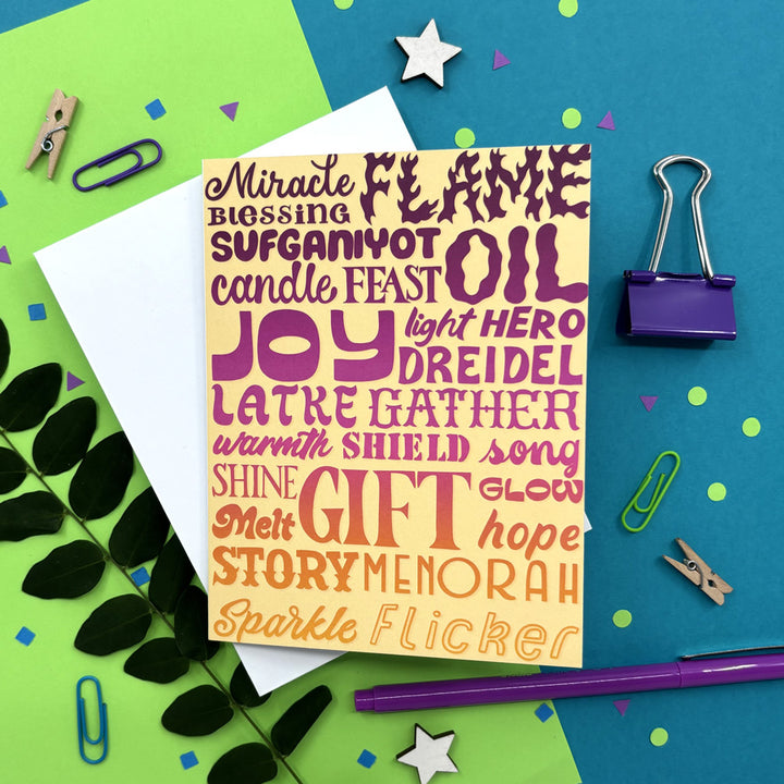 hanukkah card with colorful holiday words on a bright background