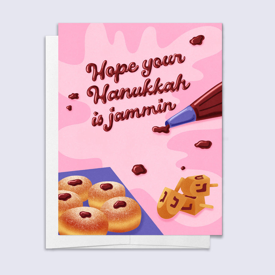hanukkah card featuring illustrated jelly donuts and piping bag with jam spelling "hope your hanukkah is jammin"