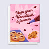 hanukkah card featuring illustrated jelly donuts and piping bag with jam spelling "hope your hanukkah is jammin"