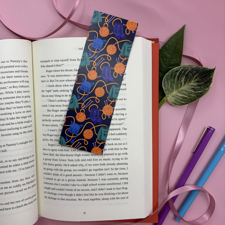 bookmark with colorful cat and yarn pattern on an open book