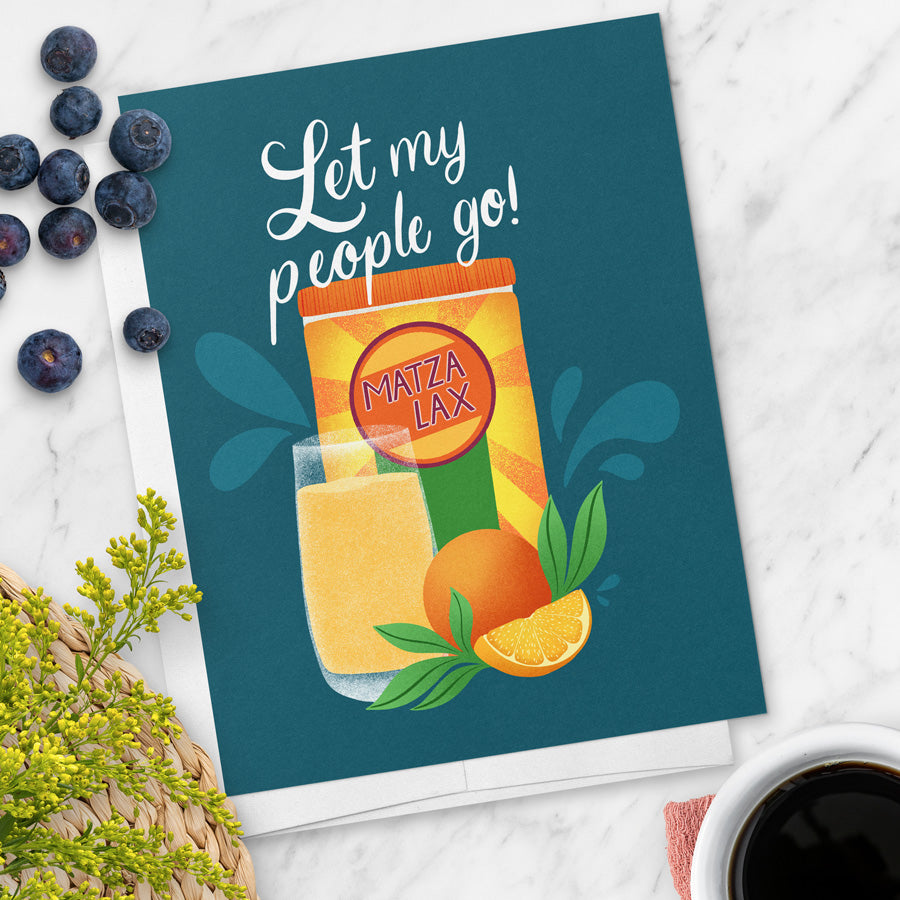 Card with 'Let my people go! Matza Lax' text and illustration on a blue background with oranges and leaves.