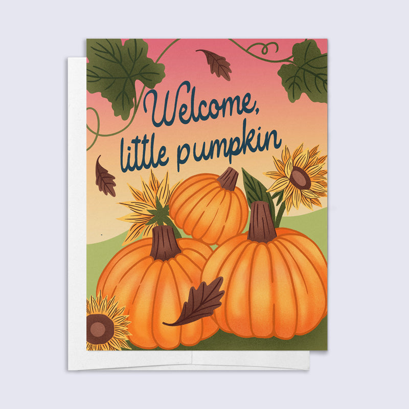Greeting card with pumpkins and sunflowers and 'Welcome, little pumpkin' text on a pink background.