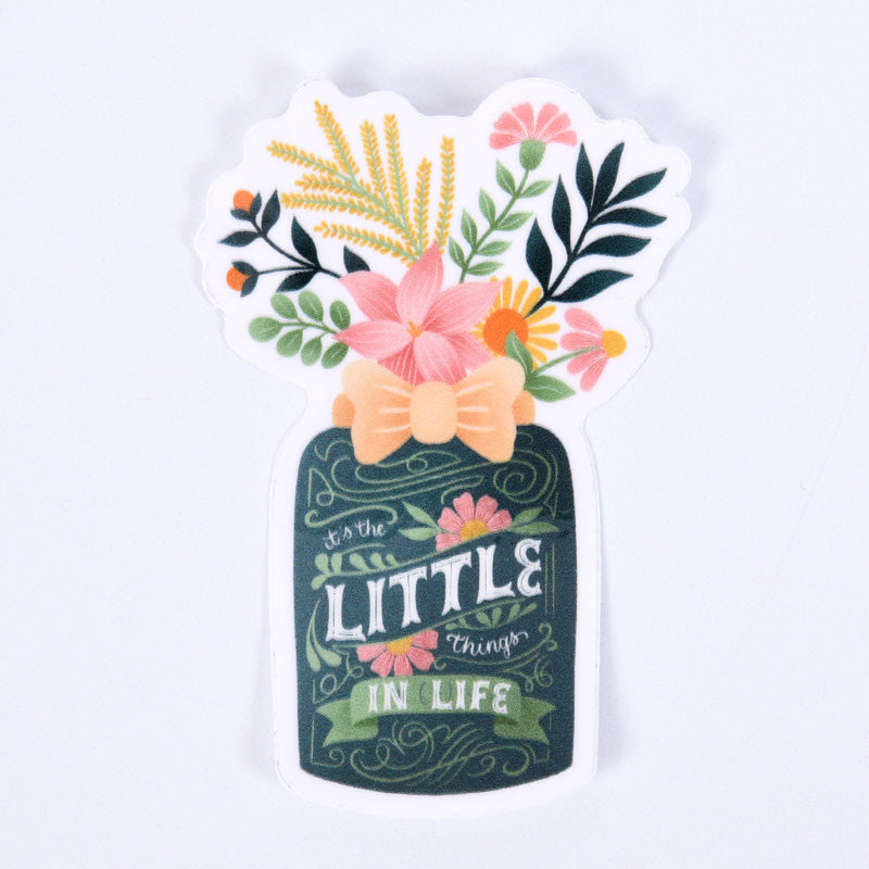 A sticker with a floral design and the phrase 'It's The Little Things In Life' written on it.