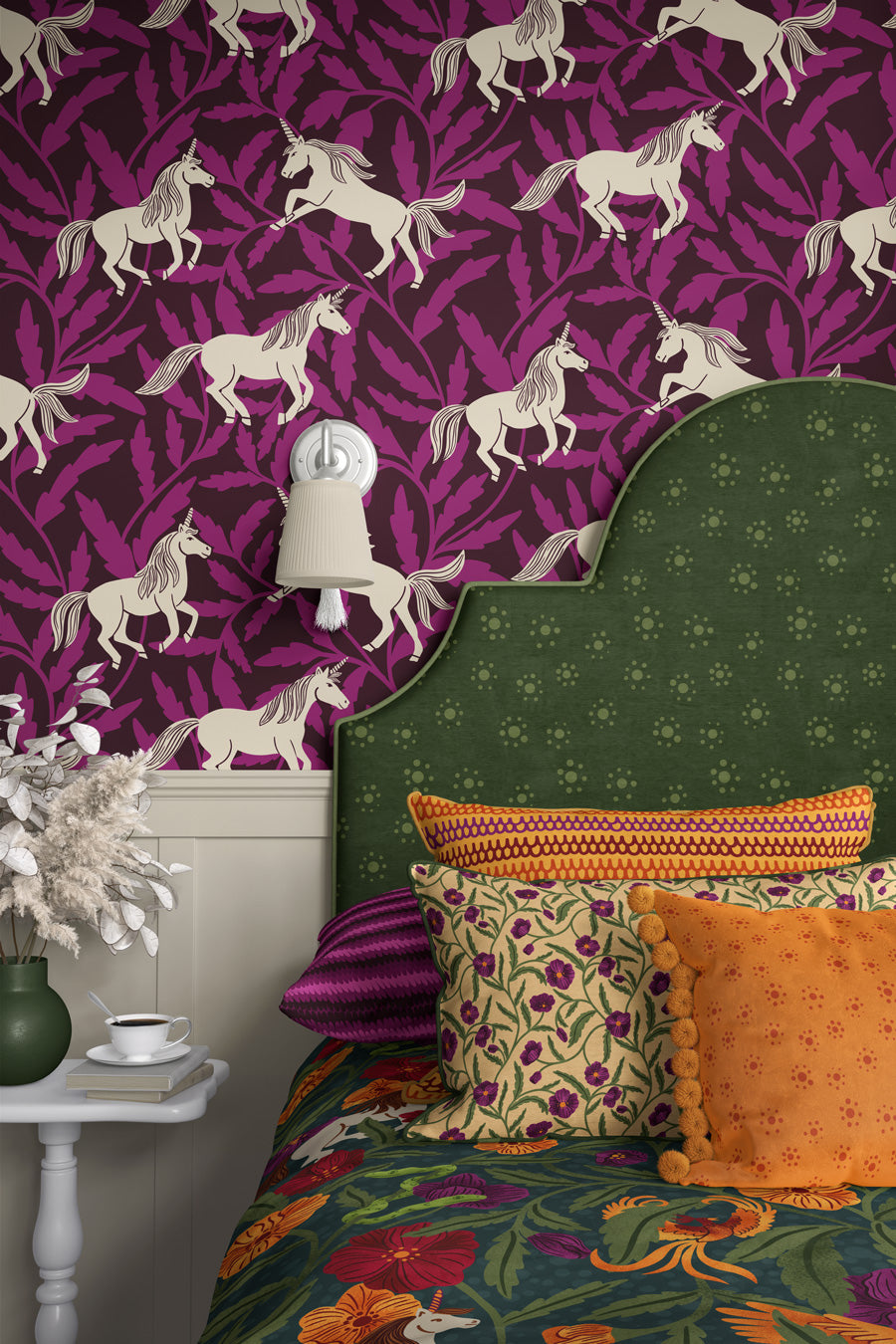 Bedroom with unicorn-patterned wallpaper, green headboard, and colorful bedding.
