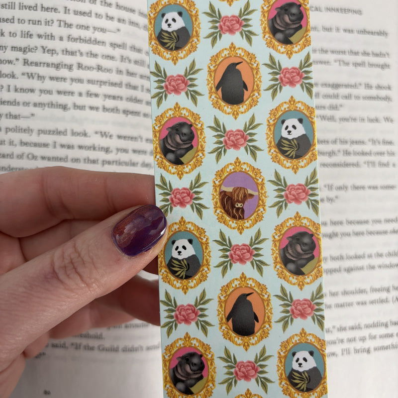 bookmark featuring illustrations of cute baby animals in gold ornate frames