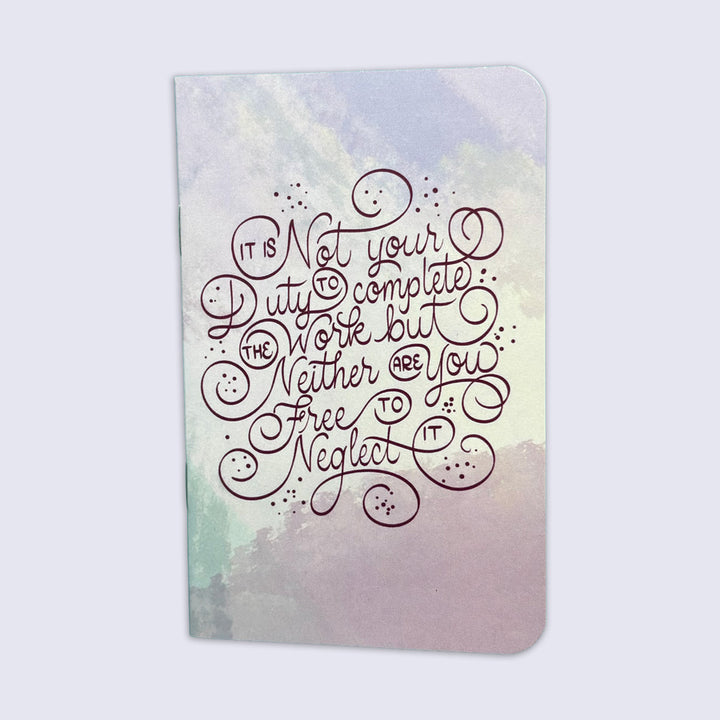 small notebook with rounded corners and watercolor background with swirling lettering "it is not your duty to complete the work but neither are you free to neglect it."