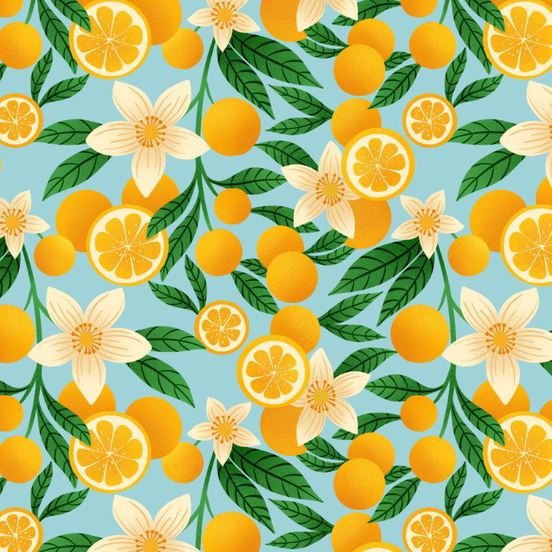 oranges and orange blossoms and green leaves on a light blue background