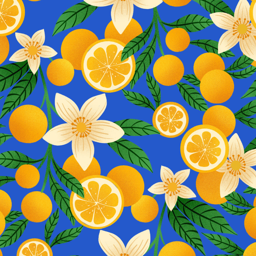 Pattern of oranges, lemon slices, and flowers on a blue background