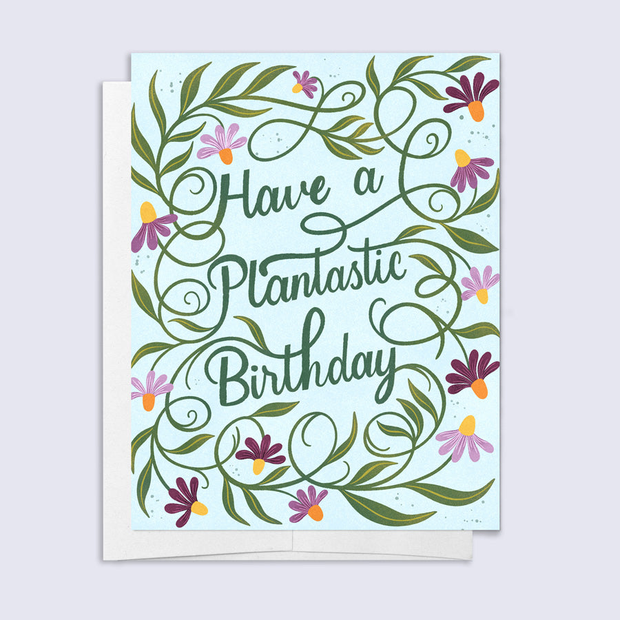 Greeting card with floral design and 'Have a Plantastic Birthday' text on a light blue background