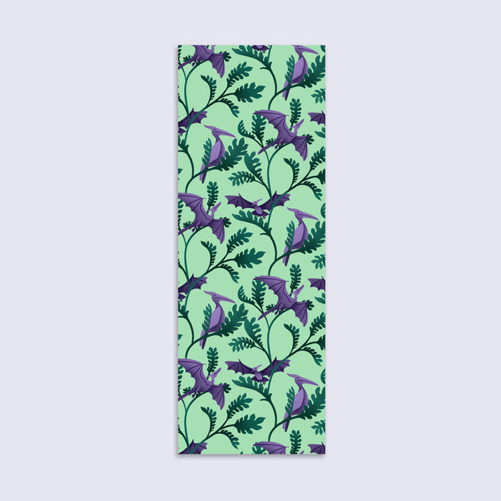 bookmark with illustrated pterodactyls flying amid Jurassic plants