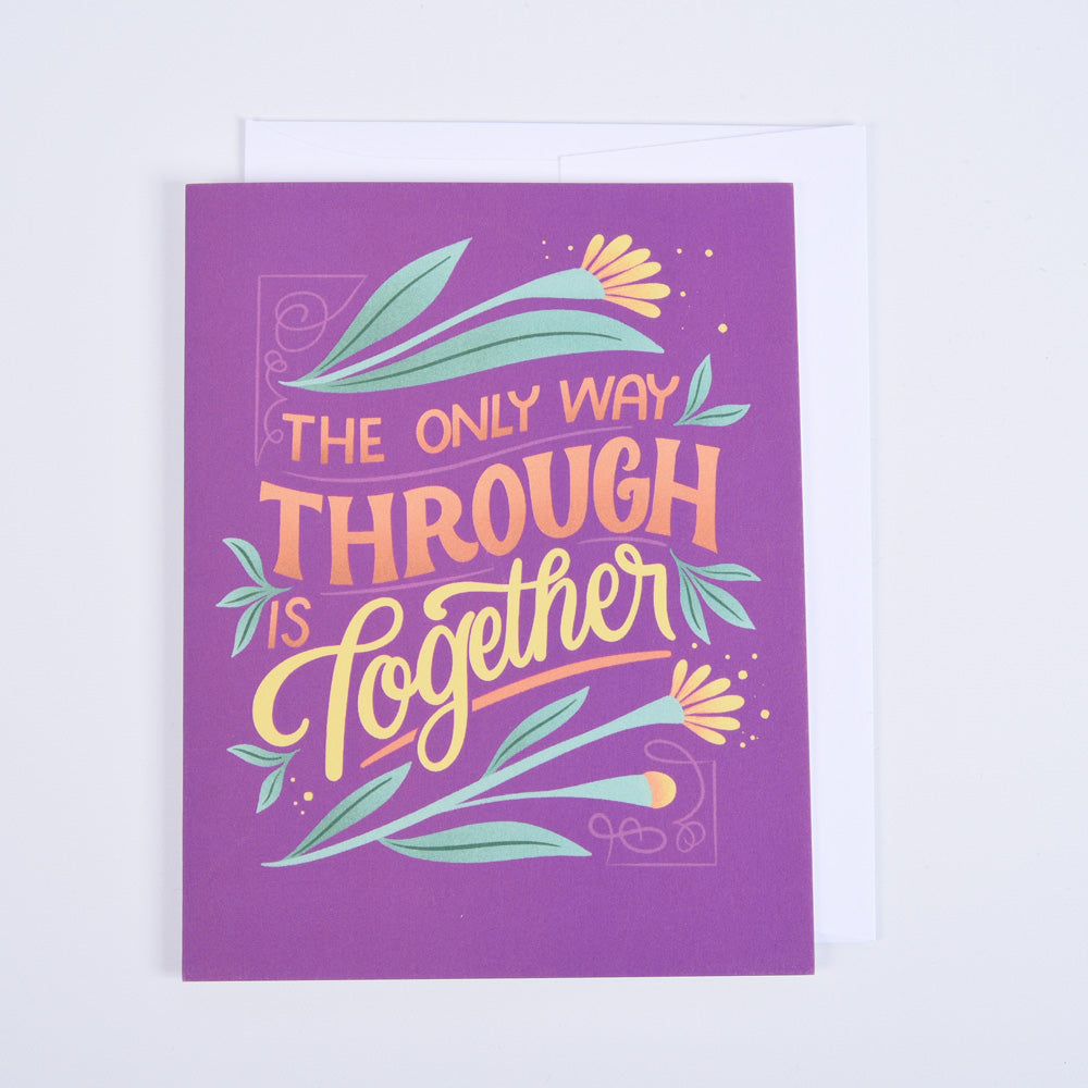greeting card of flowers and text "the only way through is together" on a bright magenta background with white envelope