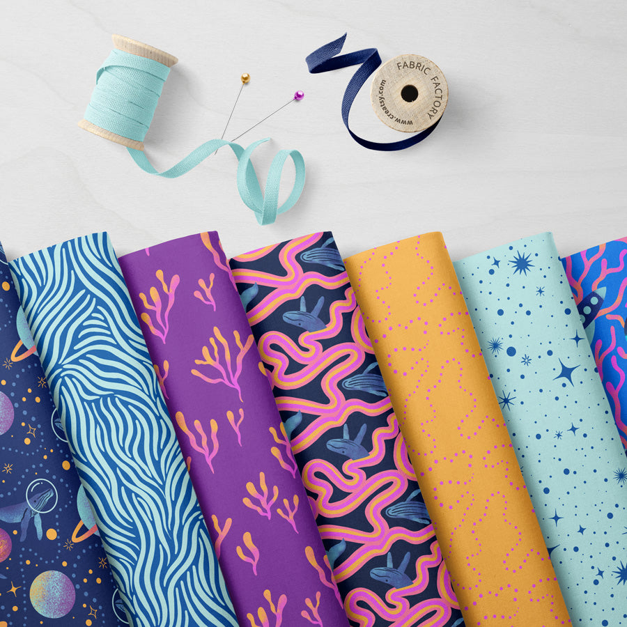 Collection of colorful patterned fabric swatches on a light background