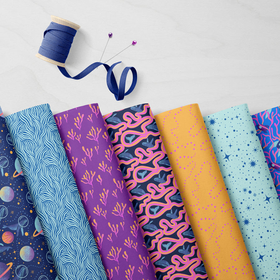 fabric bolts featuring whimsical whales and colorful marine animals