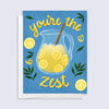 Greeting card with lemonade pitcher and text 'you're the zest' on a blue background